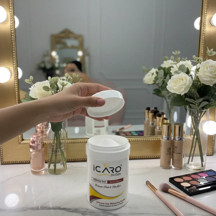 Icaro beauty powder container on vanity with makeup, flowers, and mirror background