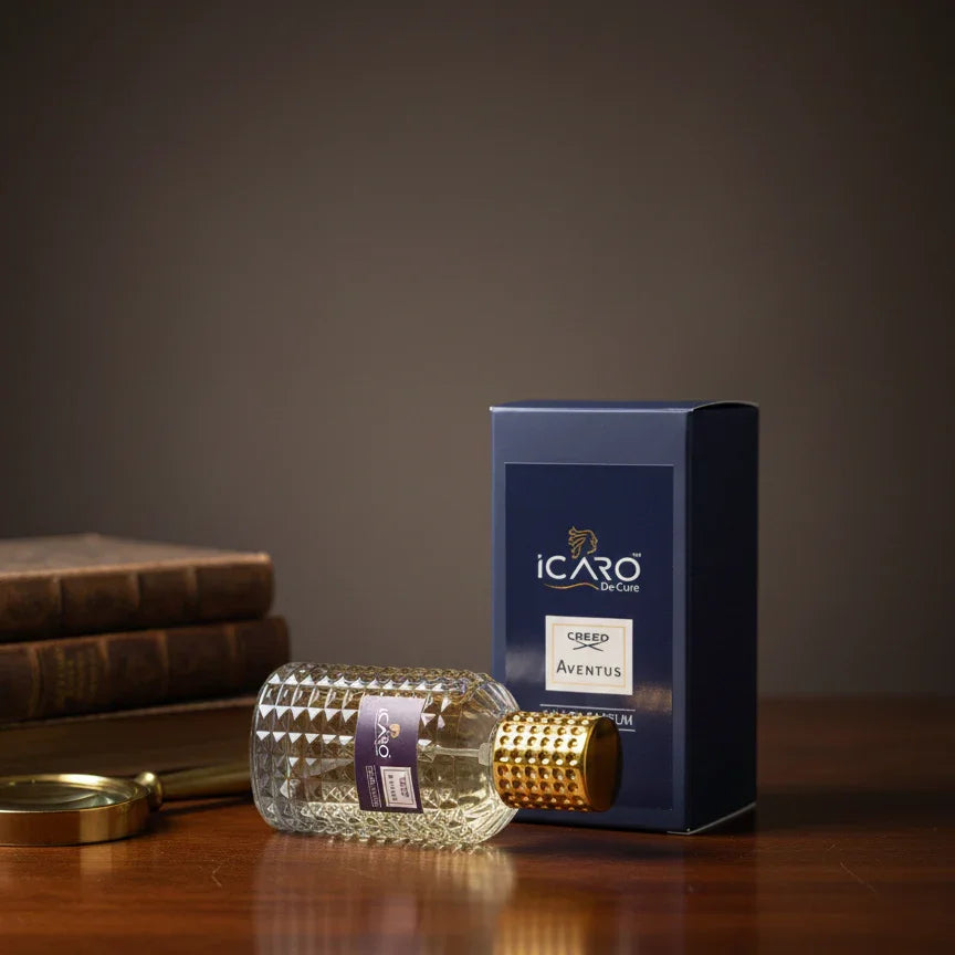 Icaro Creed Aventus perfume bottle with gold cap and blue box on wooden table