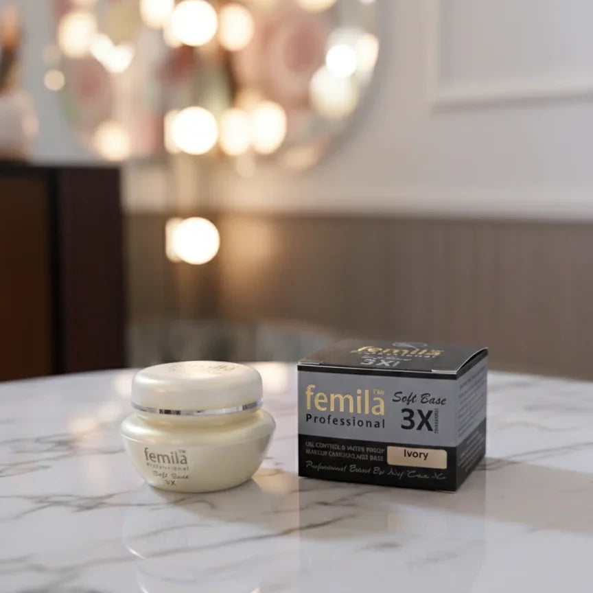 Femila Professional Soft Base 3X Ivory cream and box on marble surface with blurred lights