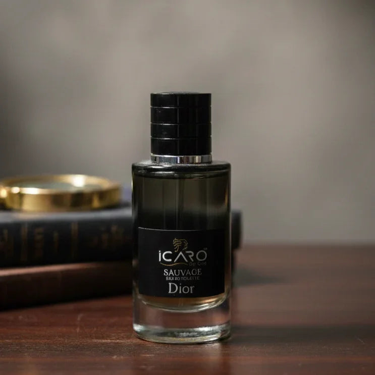 Icaro Sauvage Dior perfume bottle on wooden table with blurred books in background