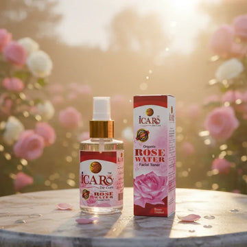 Icaro rose water facial toner bottle and packaging on stone table with blooming roses in sunlight