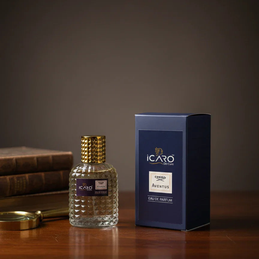 Icaro Aventus Eau de Parfum bottle with gold cap and blue box on wooden desk
