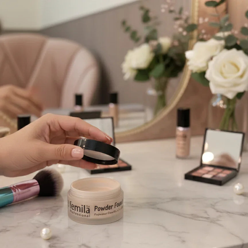 Femila Professional powder foundation and makeup products on vanity with roses and mirror